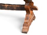 an old wooden bench with a wooden seat on it