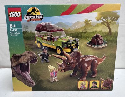 the box of the lego jurassic park set is open and ready to be played