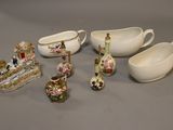 many different pieces of porcelain on the table