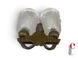 two wall lights that are attached to a wall