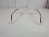 a close up of a pair of glasses on a table