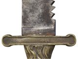 a knife that is sitting on top of a piece of metal
