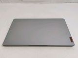 a laptop that is sitting on a white surface