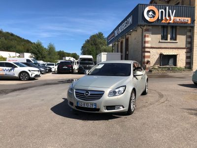 a silver car parked in front of a building