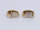a pair of gold cuff rings with a square clasp