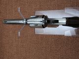 a gun that is sitting on top of a piece of paper