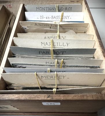 a wooden box with a bunch of books in it