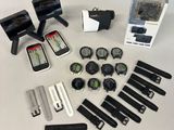 many different types of watches and gadgets laid out on a table
