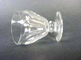 a wine glass that is sitting on a table