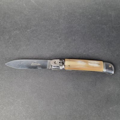 a knife that is laying on a table