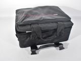 a black bag sitting on top of a white table