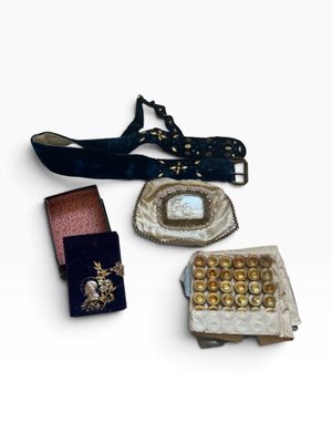 several pieces of jewelry are displayed on a white surface