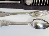 a set of silverware with spoons and forks in a box