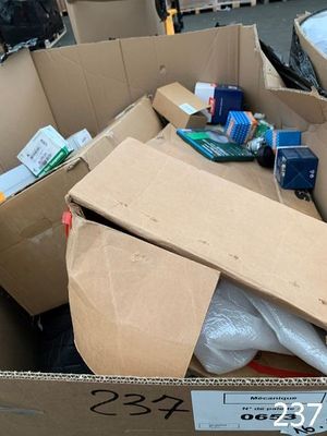a cardboard box full of toilet paper and other items