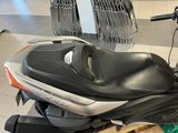 a scooter that is sitting on a pallet in a store