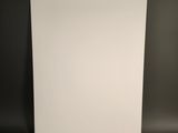 blank white paper on a black background with a shadow