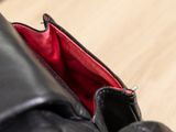 a close up of a person ' s shoe with a red lining