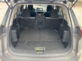 a trunk of a car with the back seats folded down