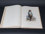 an open book with a picture of a man and a dog on it