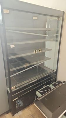 an image of a glass display case with a laptop in it