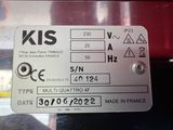 a close up of a metal sign on a red vehicle