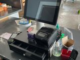 an image of a cash register and a phone on a table