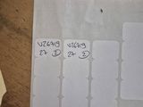 a piece of paper on a table that has some stickers on it