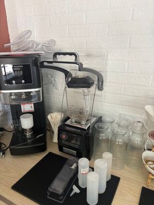 a coffee maker and a blender sitting on a counter