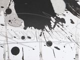 a black and white painting on the wall of a room