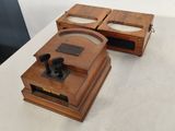 two wooden boxes that are sitting on top of a table