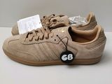 a close up of a pair of shoes with a tag on them