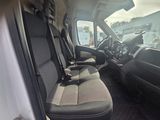 a view of the inside of a vehicle with the driver ' s seat up