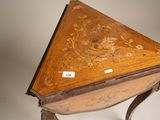a small wooden table with a triangle shaped table top