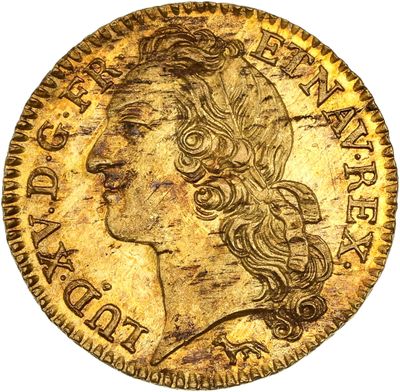 une pièce d'or représentant la tête d'une femme aux cheveux longs