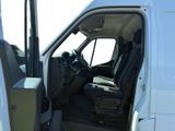a white van with the door open and the driver ' s seat down
