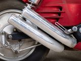 a close up of a motorcycle with a big exhaust pipe