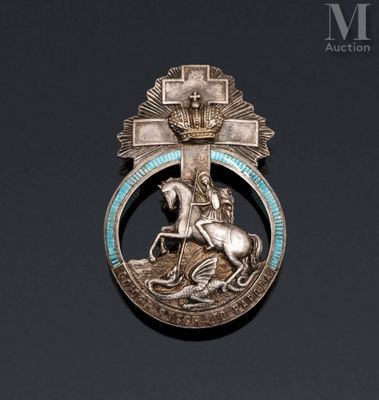 an image of a silver broochle with a horse and a man on a horse