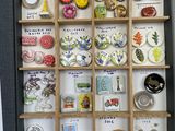a box with many different types of brooches in it