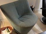 a chair and a table in a living room