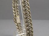 sterling silver bracelet on clear acrylic stand with clear acrylic base