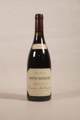 a bottle of wine that is sitting on a table