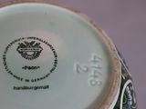 a close up of a vase with a label on it