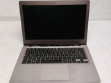 an open laptop computer sitting on top of a white table