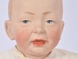a baby that is wearing a white shirt and a tie