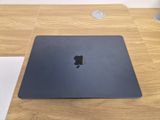 an apple macbook pro laptop sitting on top of a wooden desk