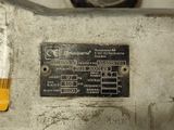 a close up of a metal plate with a number on it