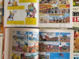 a lot of comic books that are on the table
