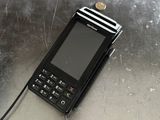 a cell phone sitting on top of a metal table