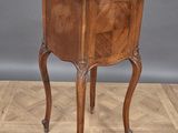 an old wooden table with a drawer on top of it on a wooden floor