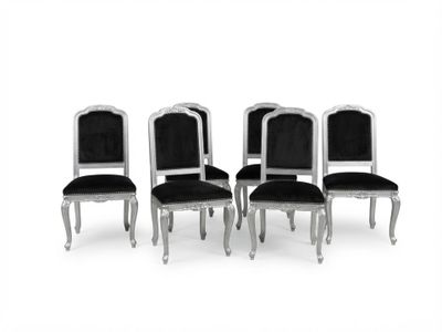 lot de quatre chaises avec des assises rembourrées en velours noir